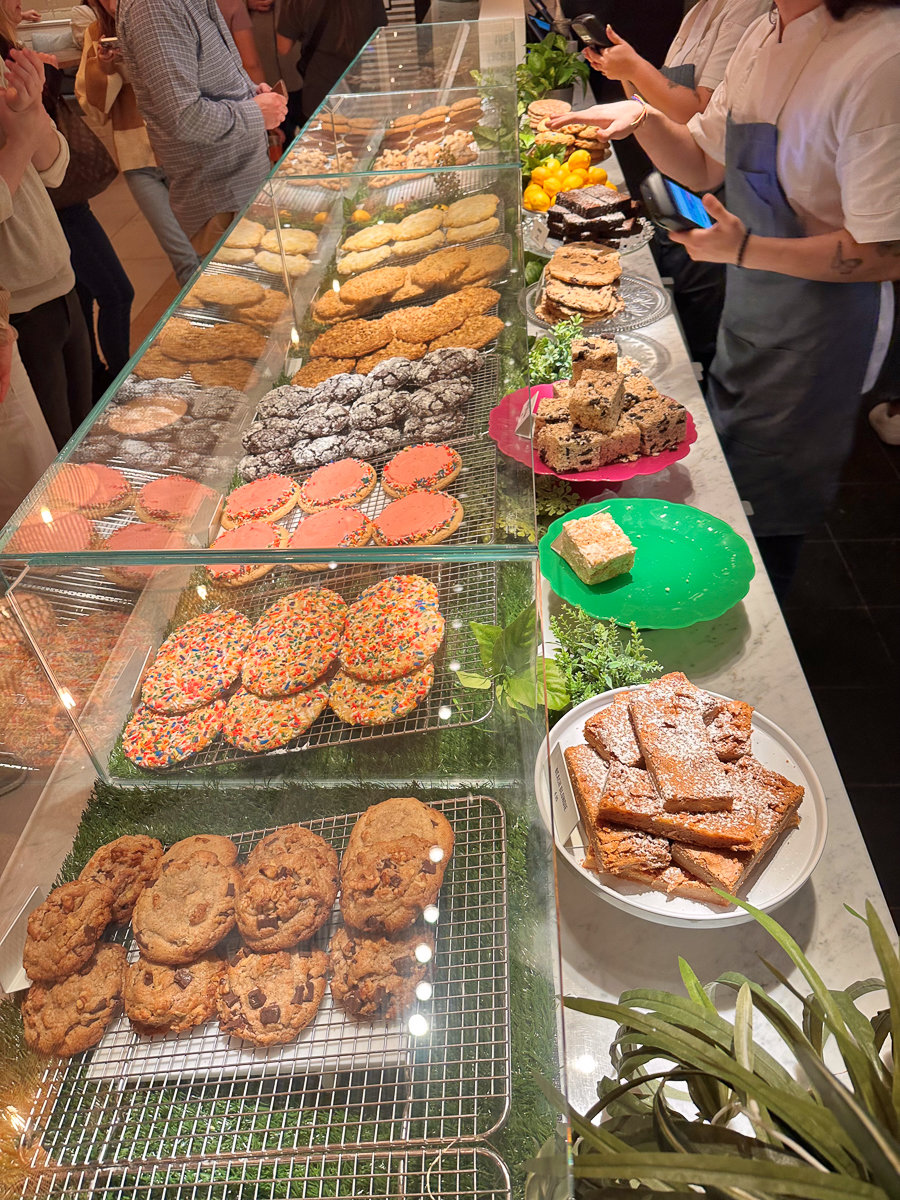 cookie bar with a variety of cookies in a glass case